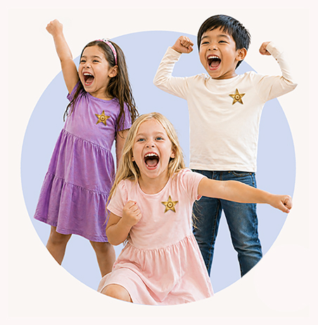 Children celebrating together with raised arms, proudly declaring ‘I AM BRAVE’ during an I AM BRAVE Movement storytime experience.